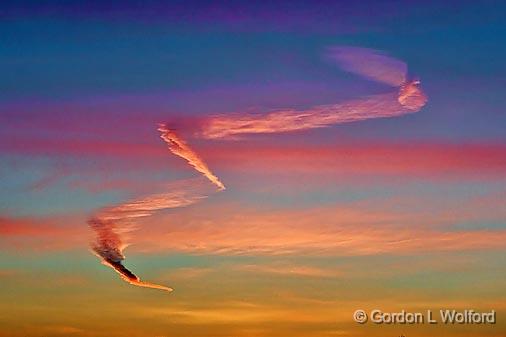 Sunrise Sky Squiggle_08302.jpg - Contrail distorted by atmospheric windsPhotographed near Smiths Falls, Ontario, Canada.